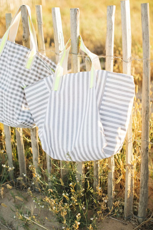 Resin-coated linen beach bag with gray and fluorine stripes