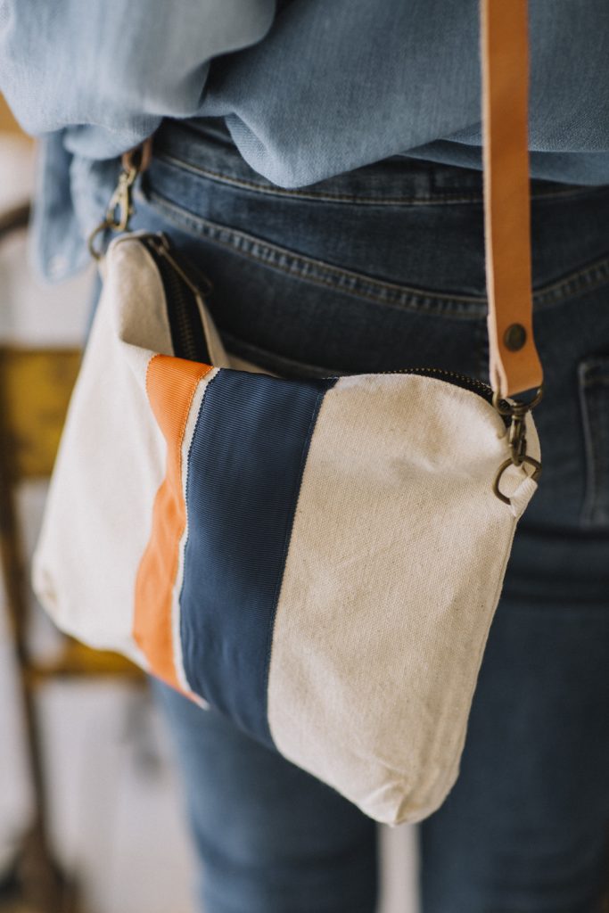 Canvas shoulder bag with navy blue and orange grosgrain ribbons