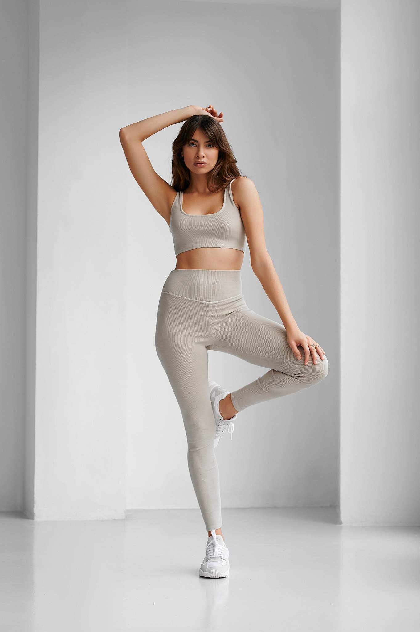 Kefi Top - Charcoal Gray - Front Image - Model in Yoga Pose - Ribbed Fabric - Second-skin fit - Easy-to-Wear & Versatile - Easy-to-Match - High Quality Basic - Streetstyle - Streetwear - Flattering High-raise band - Strategically placed seamed panels - tight fit, adapts to body - worn out feel - Elegant - Casual - Sophisticated - Becca & Cole